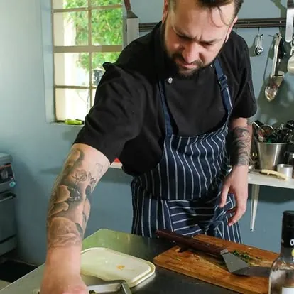 Chef Wayne preparing food at a kitchen counter