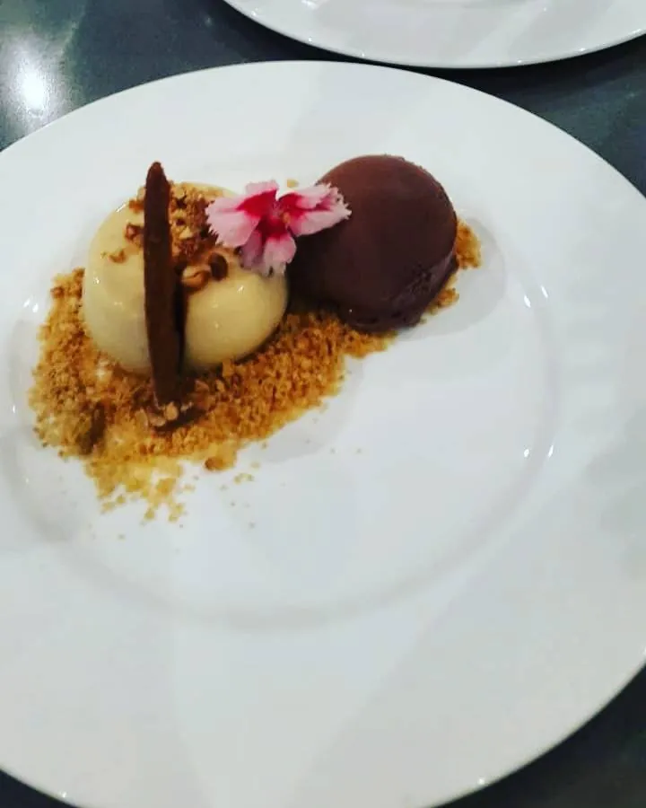 Peanut butter milk tart with chocolate ice cream and biscuit crumb